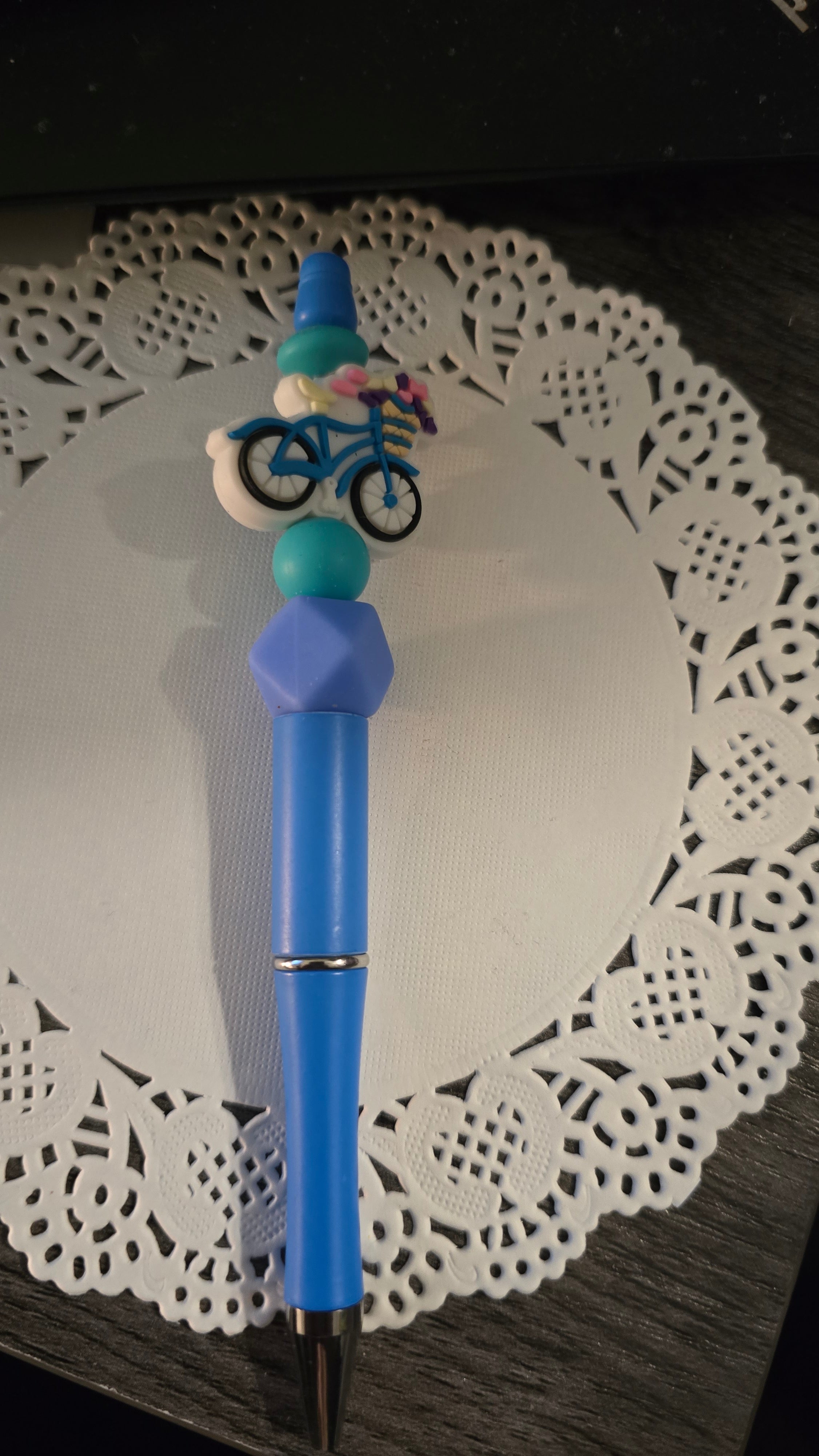 Blue pen with a bicycle bead